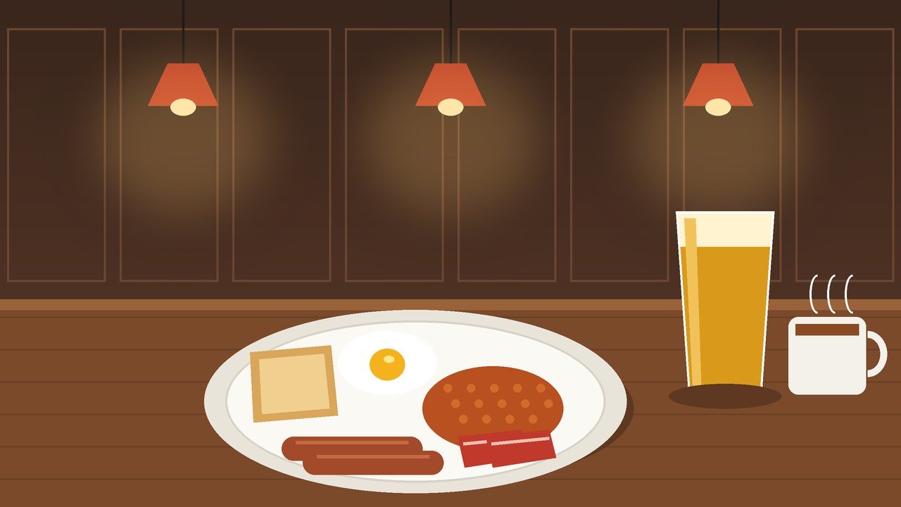 Full English breakfast with egg, sausages, bacon, beans and toast beside a pint and a cup of tea on a pub table